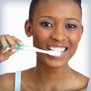 woman brushing her teeth
